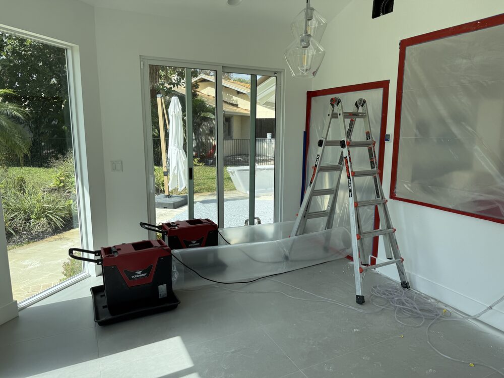 Moisture meter verifying a wall is dry